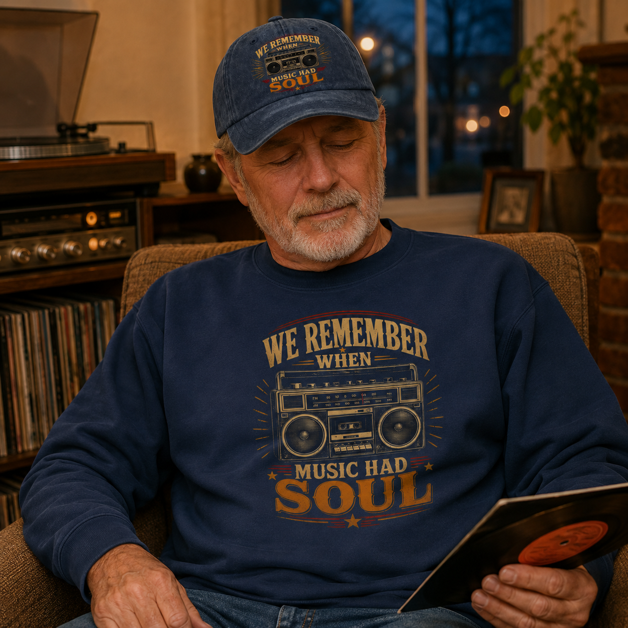 believable older man around 62 with average build and a settled, faraway expression wearing the "We Remember When Music Had Soul" vintage sweatshirt and cap in a living room armchair on a cool evening, listening to an old record with eyes half closed