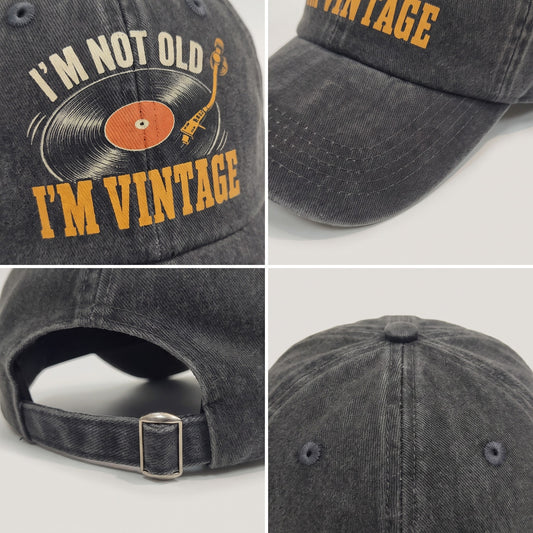 Black washed cap detail collage with front print, brim, crown, and strap