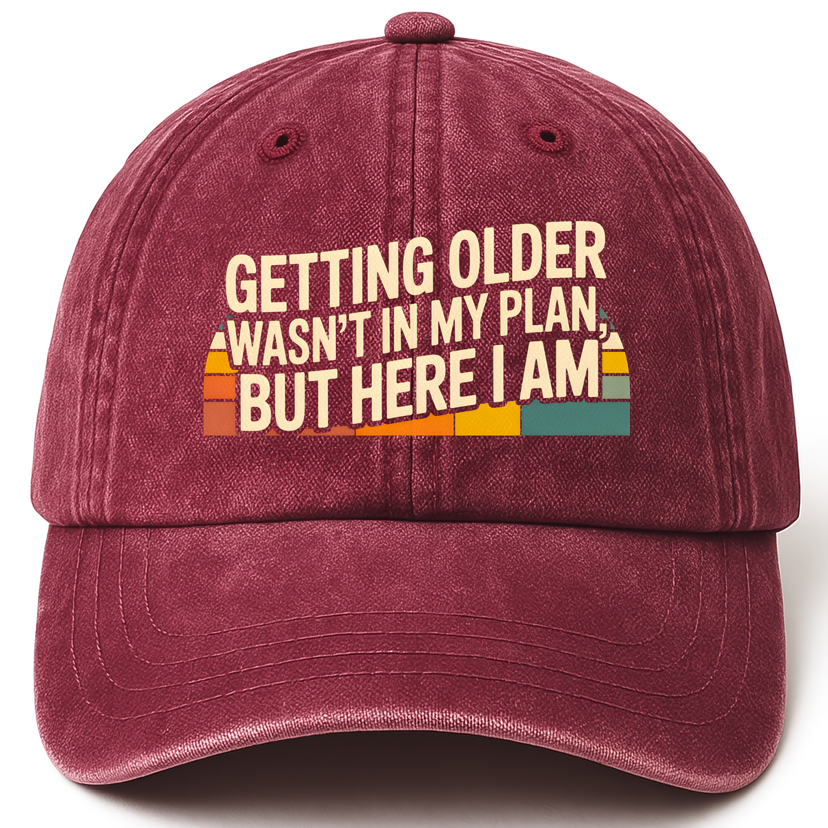 Wine Red vintage washed cap with “Getting Older Wasn’t in My Plan, But Here I Am.” Sunset Fade Reality Cap printed front desi