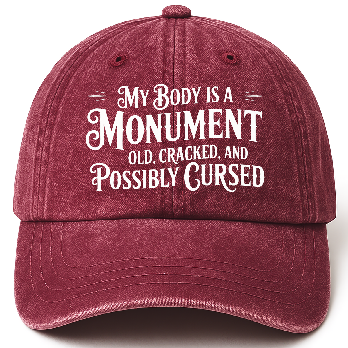Wine Red vintage washed cap with “My Body Is a Monument. Old, Cracked, and Possibly Cursed.” Gothic Humor Script Cap printed