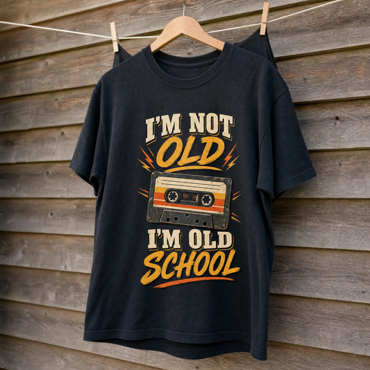 Vintage t-shirt hanging, featuring printed “41 I’m Old School” ideogram design.