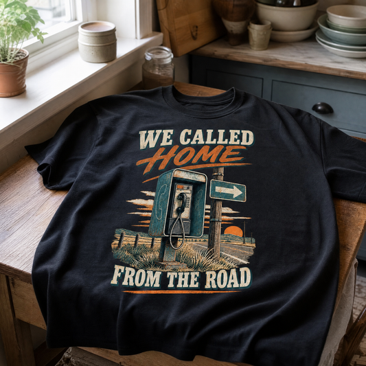 Black vintage t-shirt with “We Called Home From The Road” printed design featuring roadside phone.
