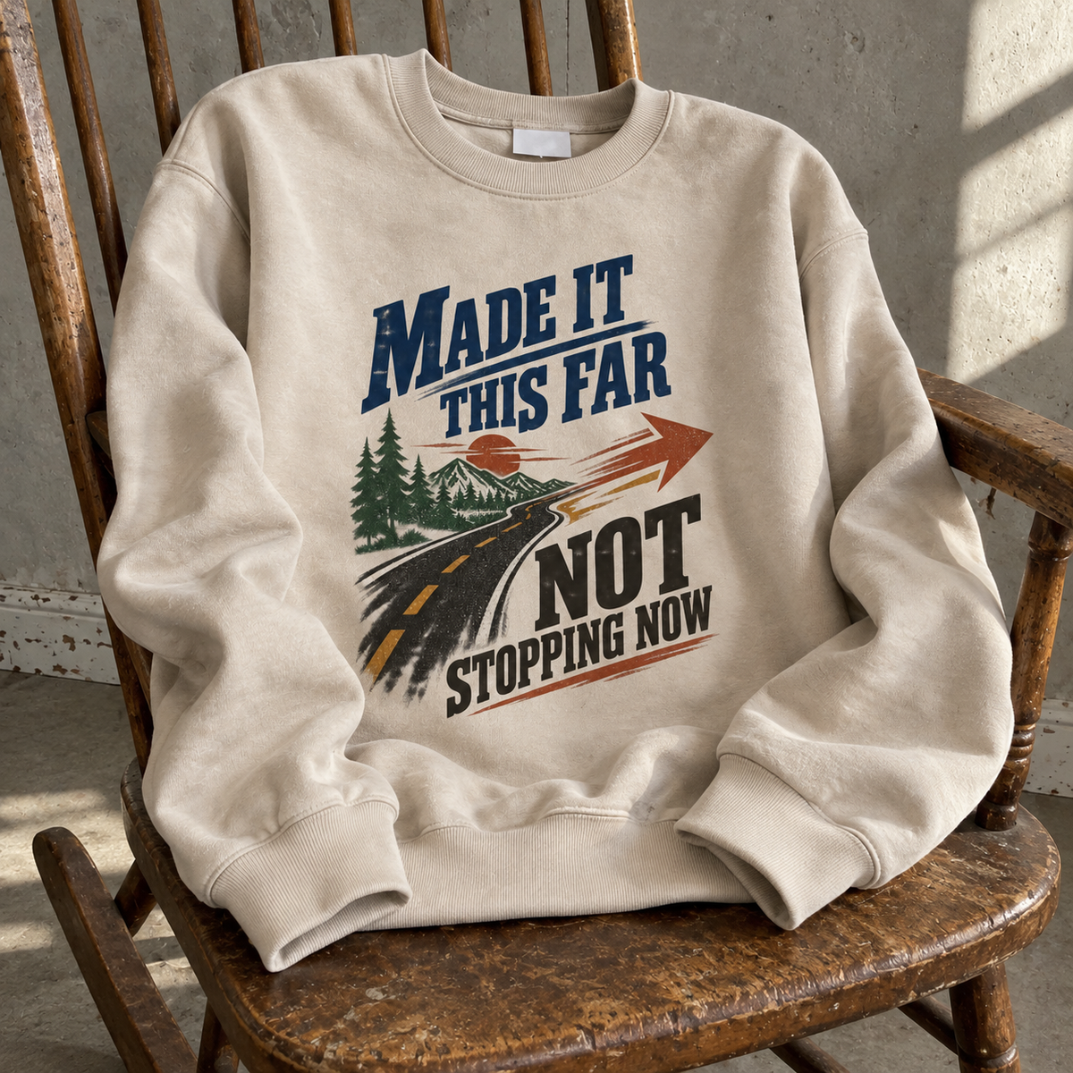Cream vintage sweatshirt with printed Made It This Far Not Stopping Now slogan