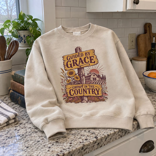 Cream vintage sweatshirt with printed Guided By Grace Grown In The Country farm design.