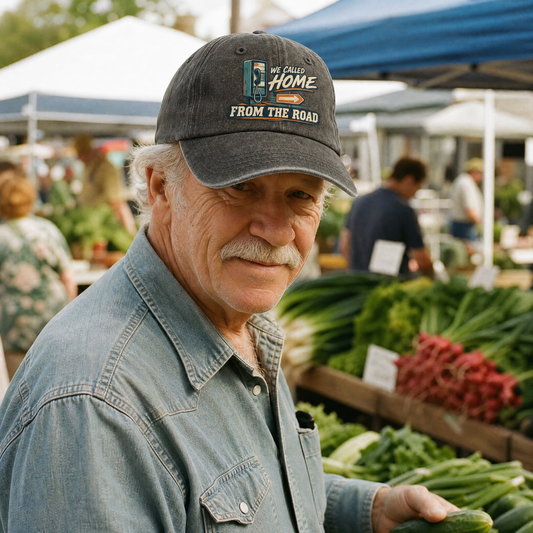 Senior man wearing a black vintage washed cap with printed road slogan at market.