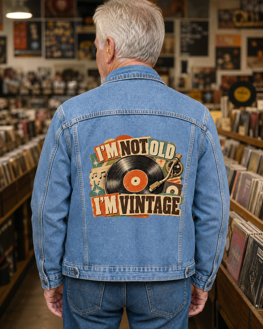 Man seen from behind in the denim jacket in a record store