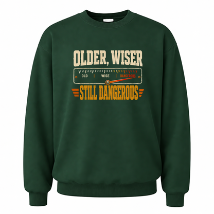 Forest Green vintage sweatshirt with Older. Wiser. Still Dangerous printed front design