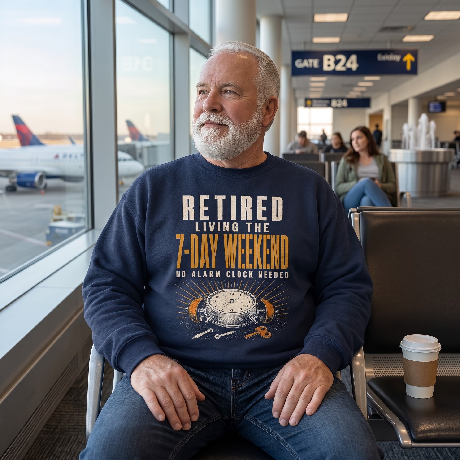 Model wearing black sweatshirt with Retired. Living the 7-Day Weekend. No Alarm Clock printed graphic
