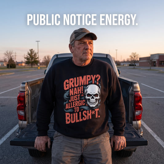 Senior man wearing black Grumpy Bullshit sweatshirt by pickup in parking lot