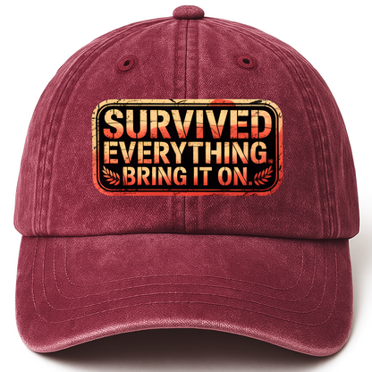 Wine Red vintage washed cap with “Survived Everything. Bring It On.” Rusted West Grit Cap printed front design