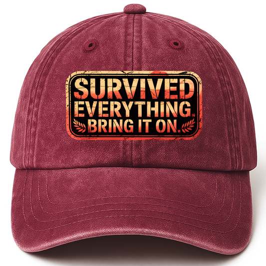 Wine Red vintage washed cap with “Survived Everything. Bring It On.” Rusted West Grit Cap printed front design