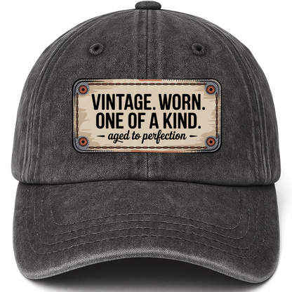 Black vintage washed cap with “Vintage. Worn. One Of A Kind. Aged To Perfection” Stitchplate Heritage Cap printed front desig