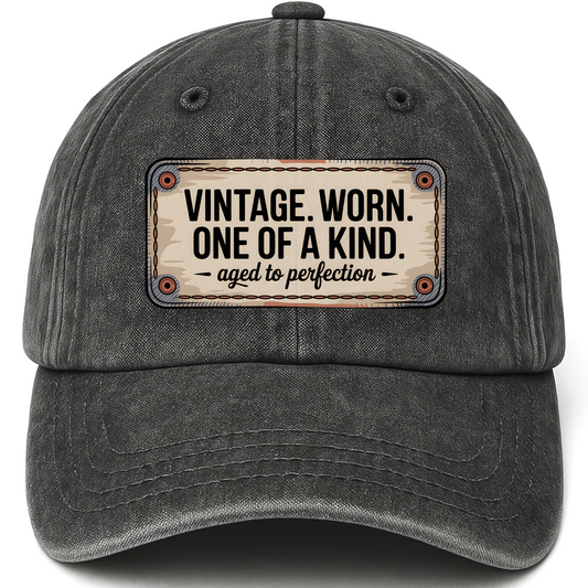 Black vintage washed cap with “Vintage. Worn. One Of A Kind. Aged To Perfection” Stitchplate Heritage Cap printed front desig