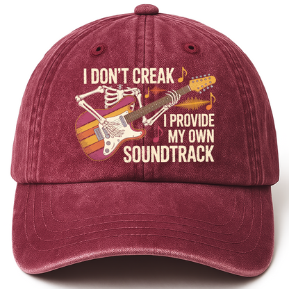 Wine Red vintage washed cap with I Don't Creak. I Provide My Own Soundtrack printed front design