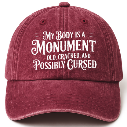 Wine Red vintage washed cap with “My Body Is a Monument. Old, Cracked, and Possibly Cursed.” Gothic Humor Script Cap printed 