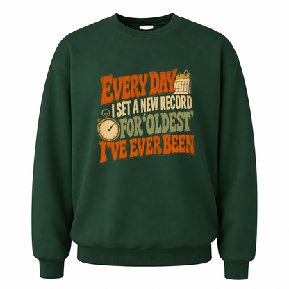 Forest Green vintage sweatshirt with Everyday I Set a New Record for Oldest I've Ever Been printed front design