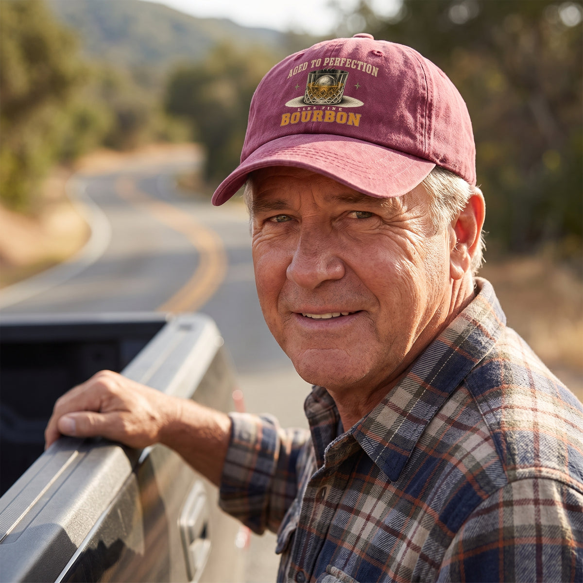 Senior man wearing burgundy bourbon cap near scenic roadside overlook
