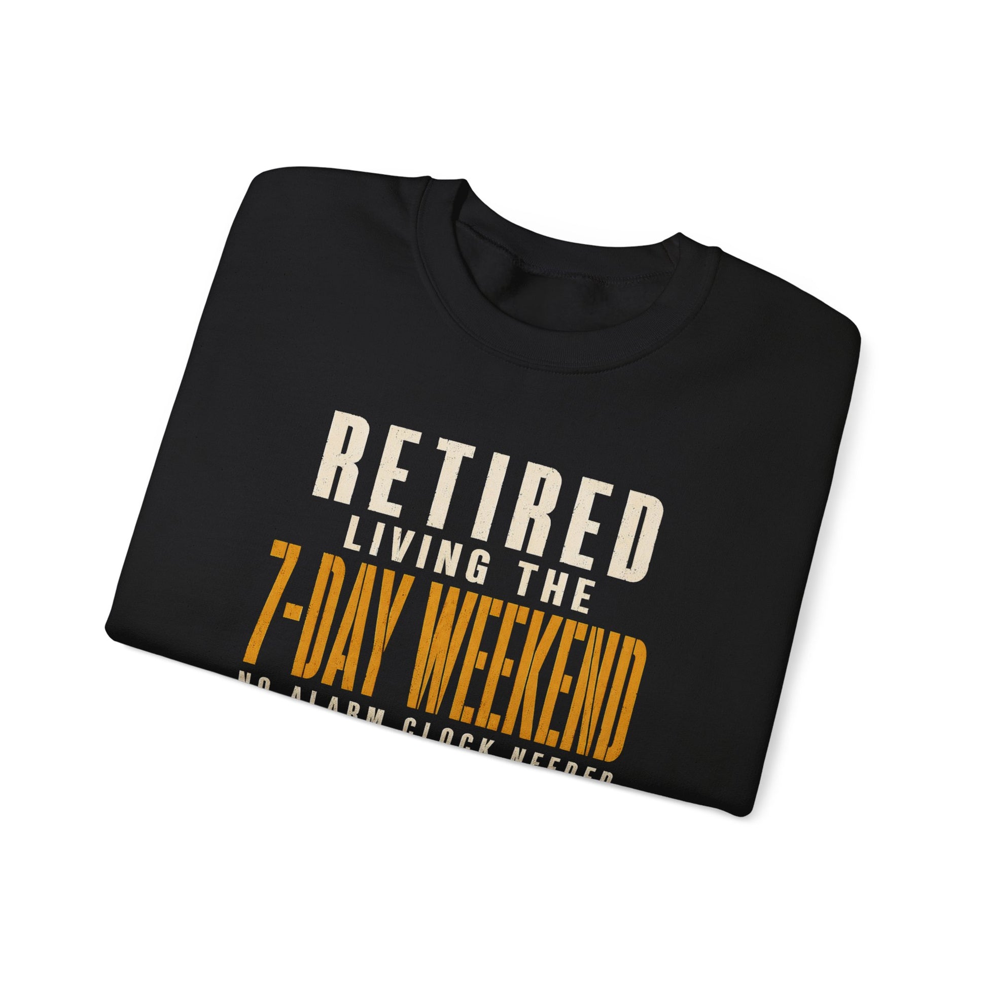 Folded black sweatshirt showing Retired. Living the 7-Day Weekend. No Alarm Clock printed graphic design