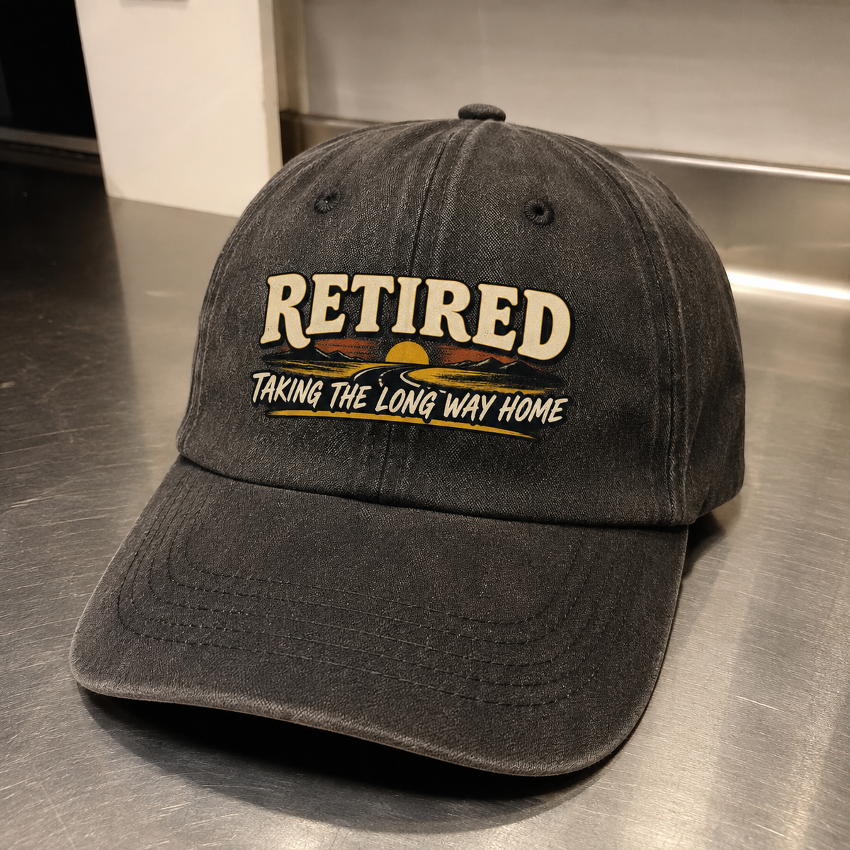 Black vintage washed cap with printed RETIRED Taking The Long Way Home slogan angled view