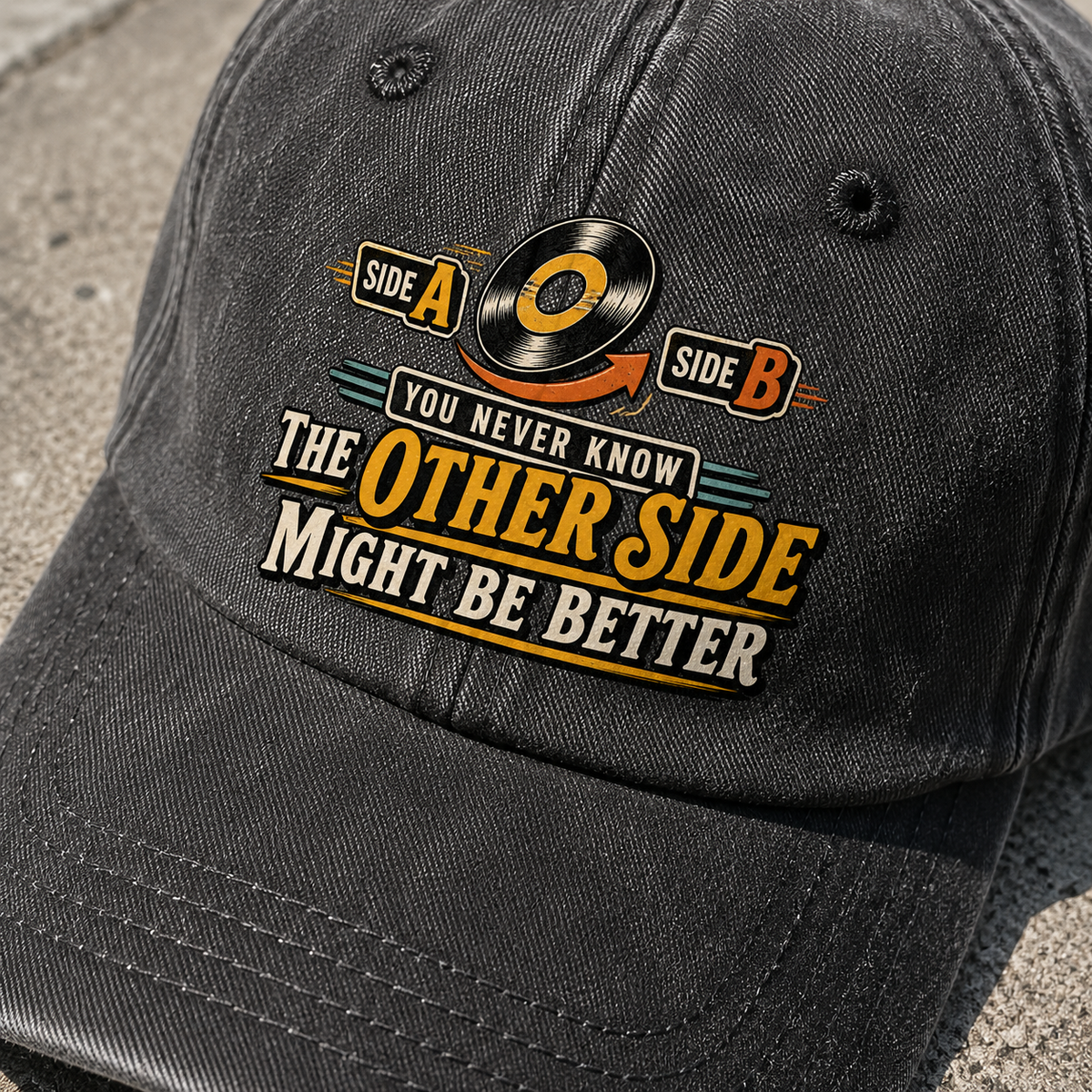Black vintage washed cap angled view, printed You Never Know. Other Side Might Be Better