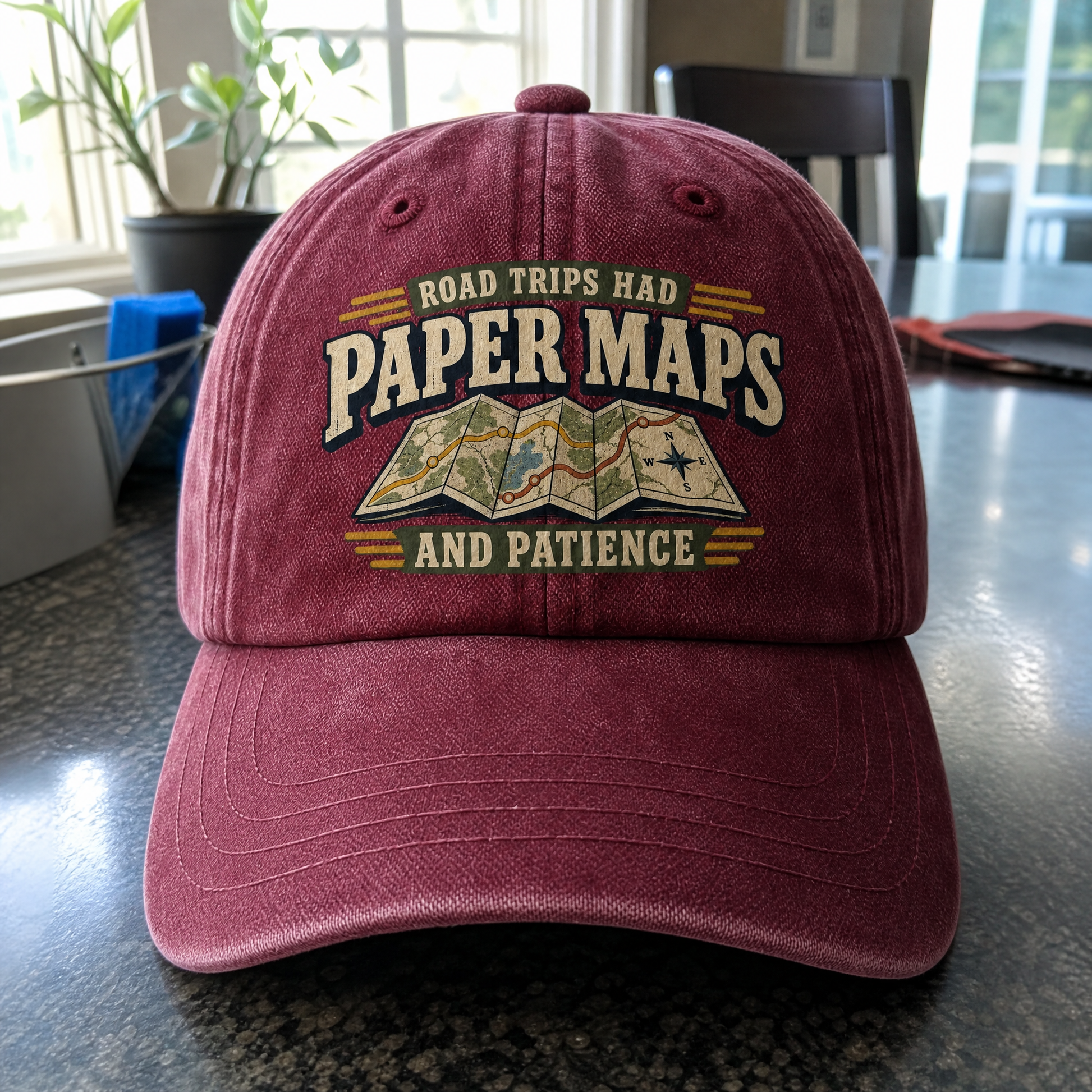 Burgundy vintage washed cap with printed Road Trips Had Paper Maps And Patience design, front angle