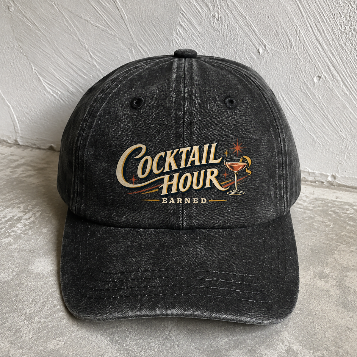 Black vintage washed cap with printed Cocktail Hour Earned slogan front angle