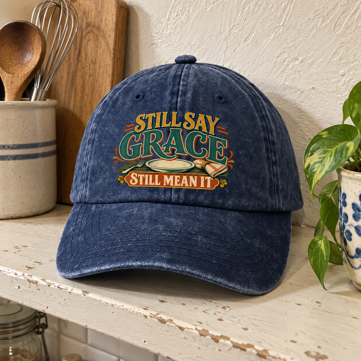 Navy vintage washed cap with printed Still Say Grace Still Mean It slogan, front view