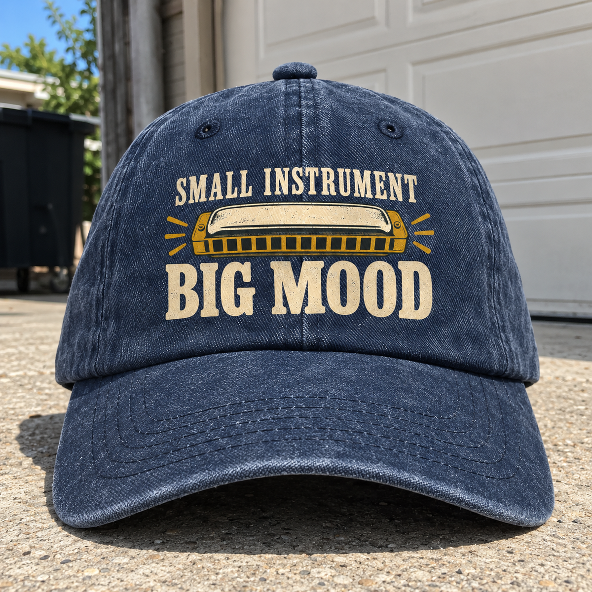 Navy vintage washed cap with printed harmonica and Small Instrument Big Mood slogan, front angle