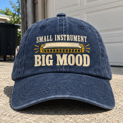 Navy vintage washed cap with printed harmonica and Small Instrument Big Mood slogan, front angle