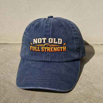 Blue vintage washed cap with printed Not Old Full Strength slogan front angle