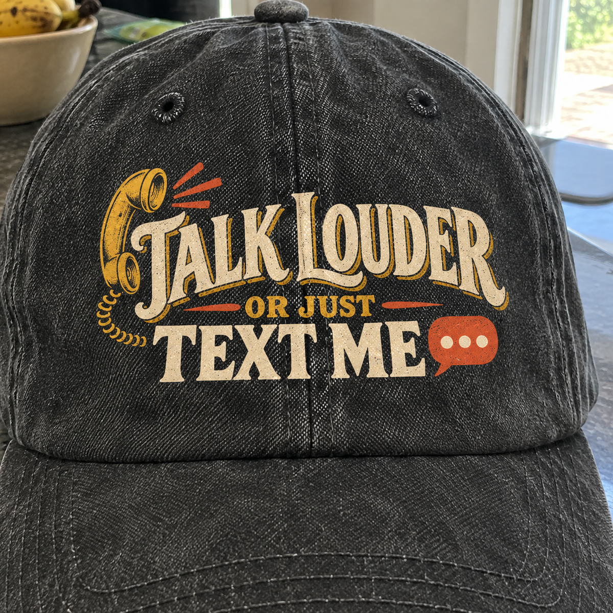 Black vintage washed cap with printed Talk Louder Or Just Text Me slogan, front angle