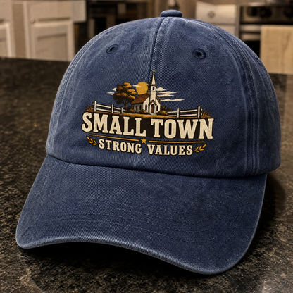 Blue vintage washed cap with printed Small Town Strong Values design, front angle view
