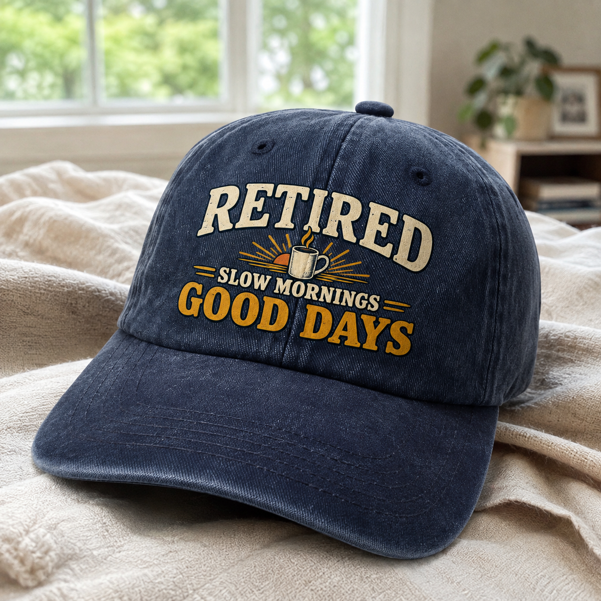 Navy vintage washed cap with printed Retired Slow Mornings Good Days slogan, angled view