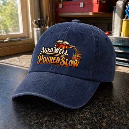 Navy vintage “Aged Well Poured Slow” slogan and whiskey glass design, angled view