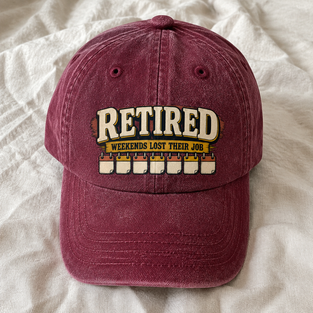 Burgundy vintage washed cap with printed Retired Weekends Lost Their Job slogan front angle