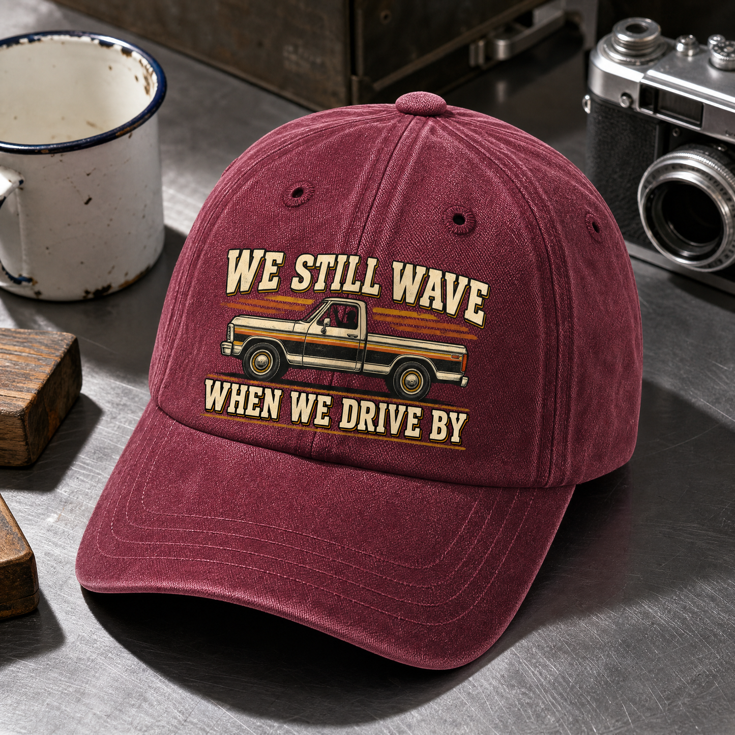 Close-up angle views of vintage washed cap with We Still Wave When We Drive By printed design