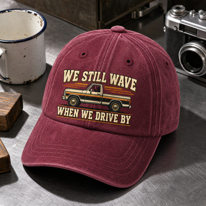 Close-up angle views of vintage washed cap with We Still Wave When We Drive By printed design