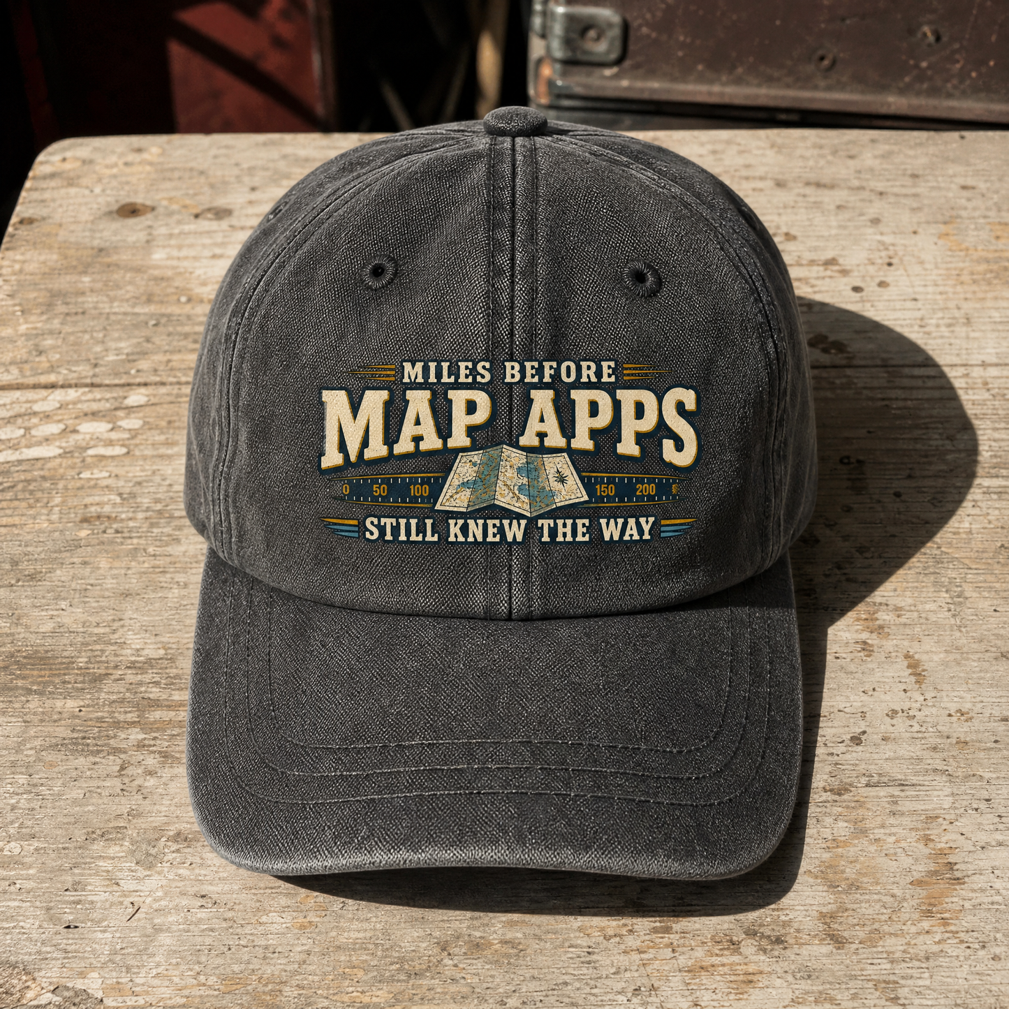 Vintage washed cap with printed “Miles Before Map Apps Still Knew the Way” slogan, front view.