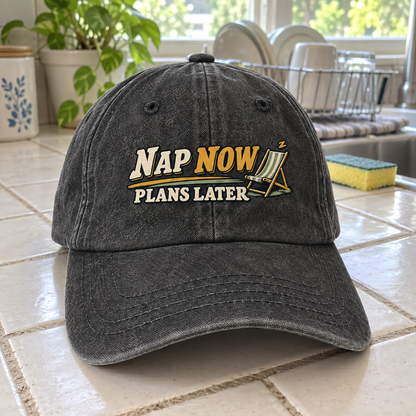 Charcoal vintage washed cap with printed Nap Now Plans Later design on tiled counter