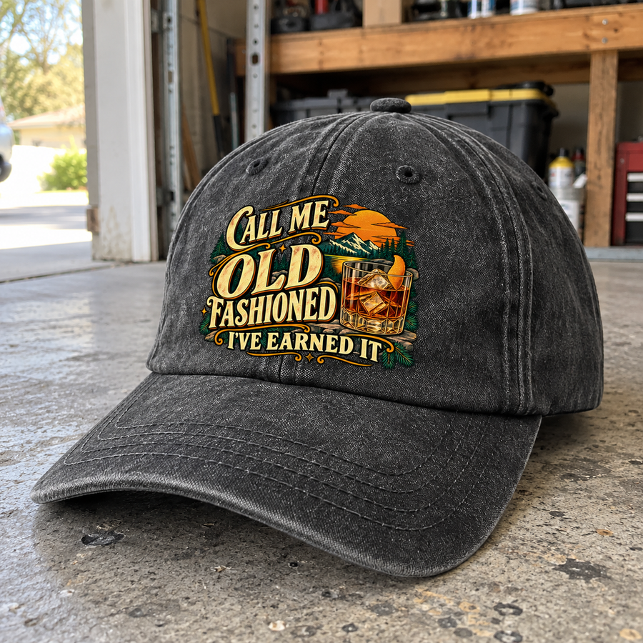Angled view of charcoal vintage washed cap printed Call Me Old Fashioned I've Earned It