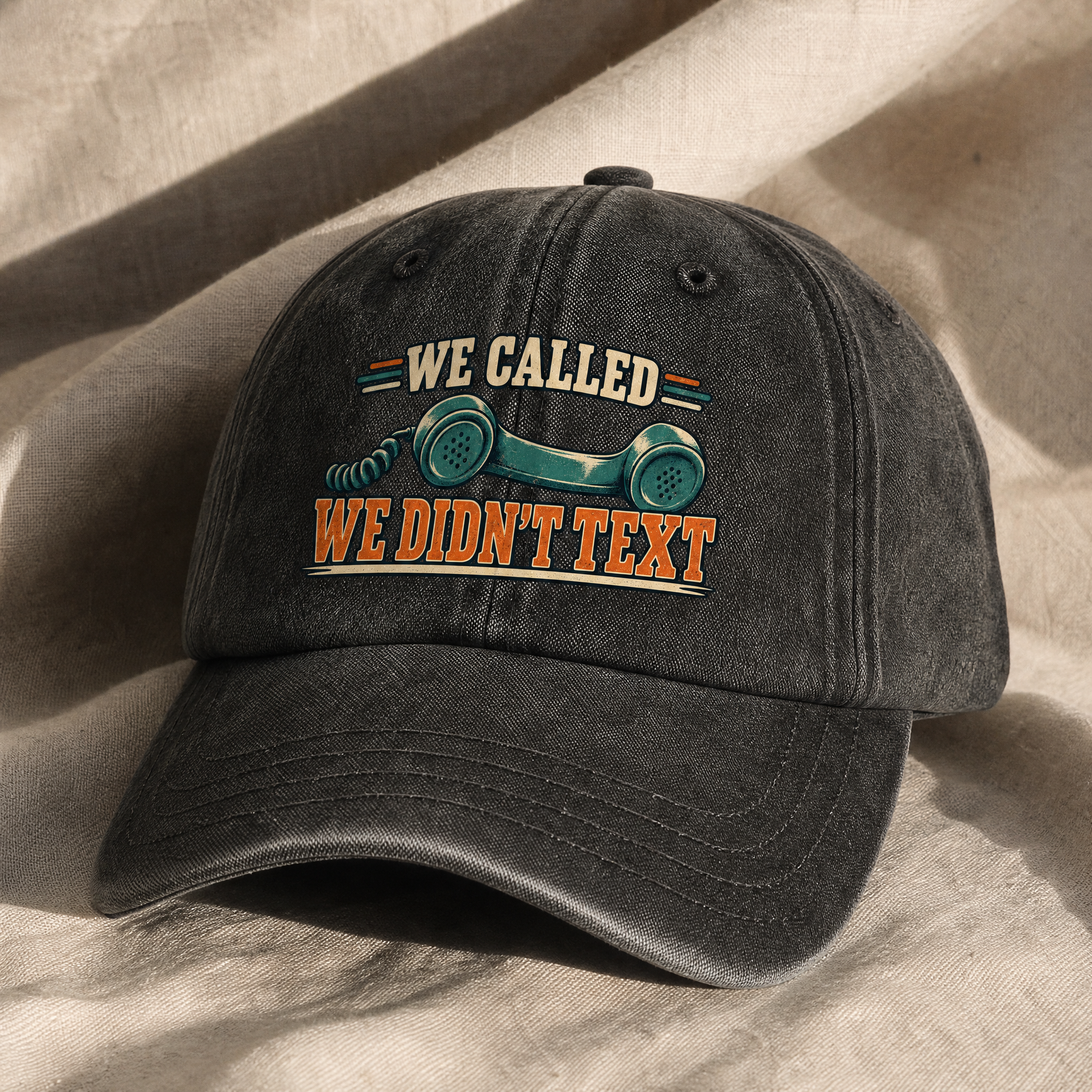 Black vintage washed cap with printed “We Called. We Didn’t Text” slogan, angled view