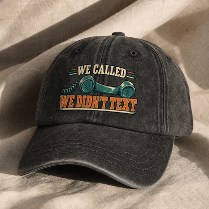 Black vintage washed cap with printed “We Called. We Didn’t Text” slogan, angled view