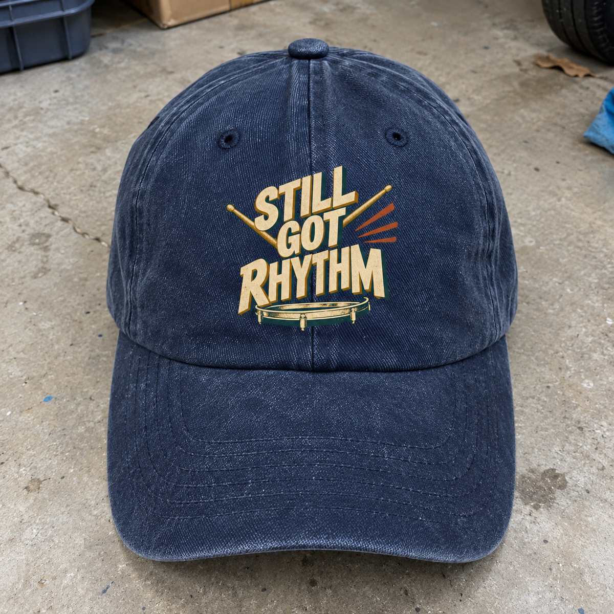 Navy vintage washed cap with printed Still Got Rhythm slogan, front angle view