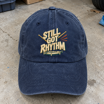 Navy vintage washed cap with printed Still Got Rhythm slogan, front angle view