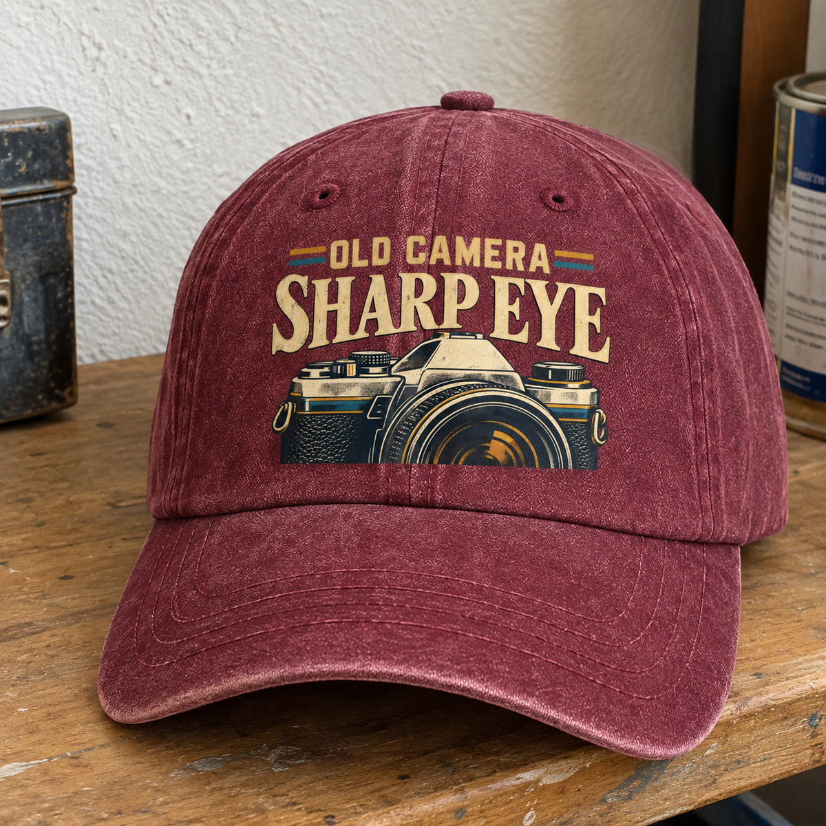 Burgundy vintage washed cap with printed Old Camera Sharp Eye slogan and camera design, front angle