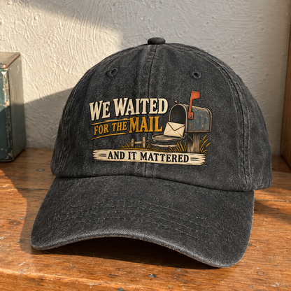 Black vintage washed cap with printed “We Waited For The Mail And It Mattered” design, front angle