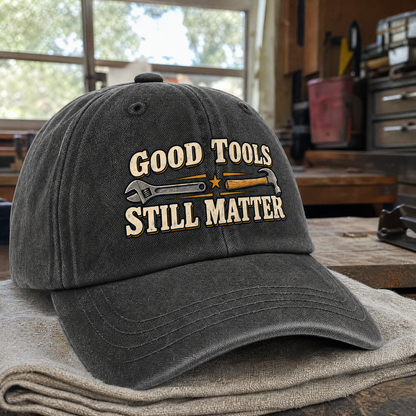 Dark gray vintage washed cap with Good Tools Still Matter printed design, angled view