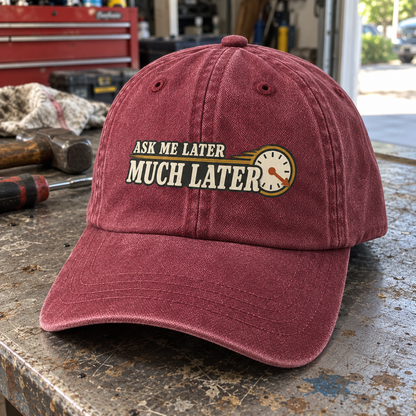 Angled view of burgundy vintage washed cap with printed Ask Me Later Much Later clock design.