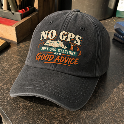 Black vintage washed cap with printed “No GPS Just Gas Stations And Good Advice” slogan, angled view