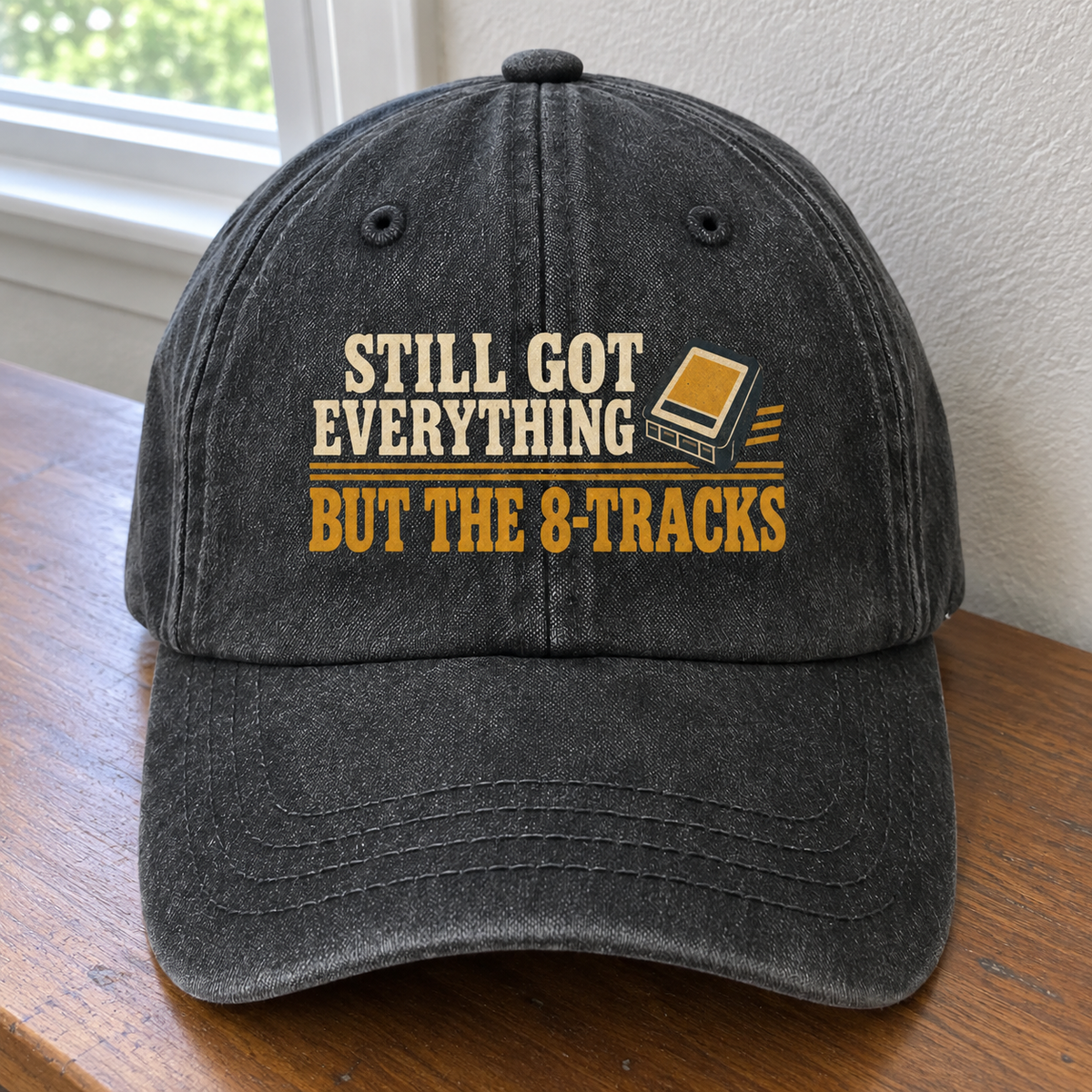 Black vintage washed cap with printed Still Got Everything But The 8-Tracks slogan, front angle view